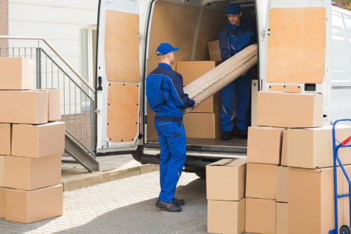 Furniture removals team handling a sofa move in Maida Hill
