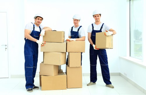 Professional movers handling furniture during a Maidahill house move