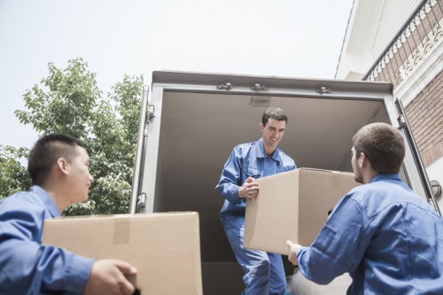 Professional packing and unpacking services in Maidahill with organized moving boxes