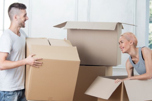 Packing and preparing belongings for a moving truck in Maidahill