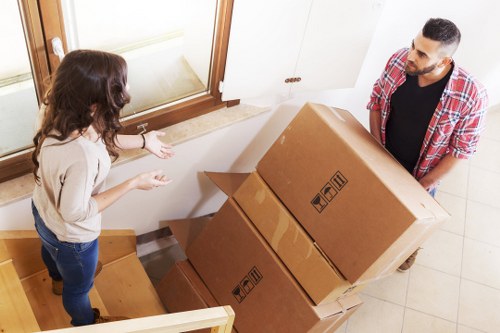 Careful unloading of boxes and furniture during a Maidahill move