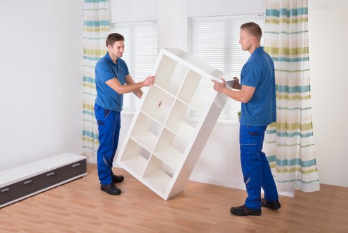 Worker securing furniture in a van for safe transport