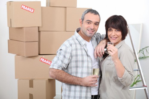 Professional movers handling furniture during flat removals in Maidahill